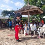 a mickey mouse mascot entertaining guests at the asaba fun fair held at the nelson mandela gardens and resorts