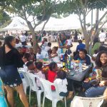Gathering of Fun lovers on a table at the Asaba Fun fair held at the Nelson mandela gardens and resorts