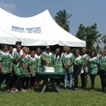 Dr Newton Jibunoh celebrating Mandela Day in 2023 with staff of Fade foundation and Nelson Mandela Gardens